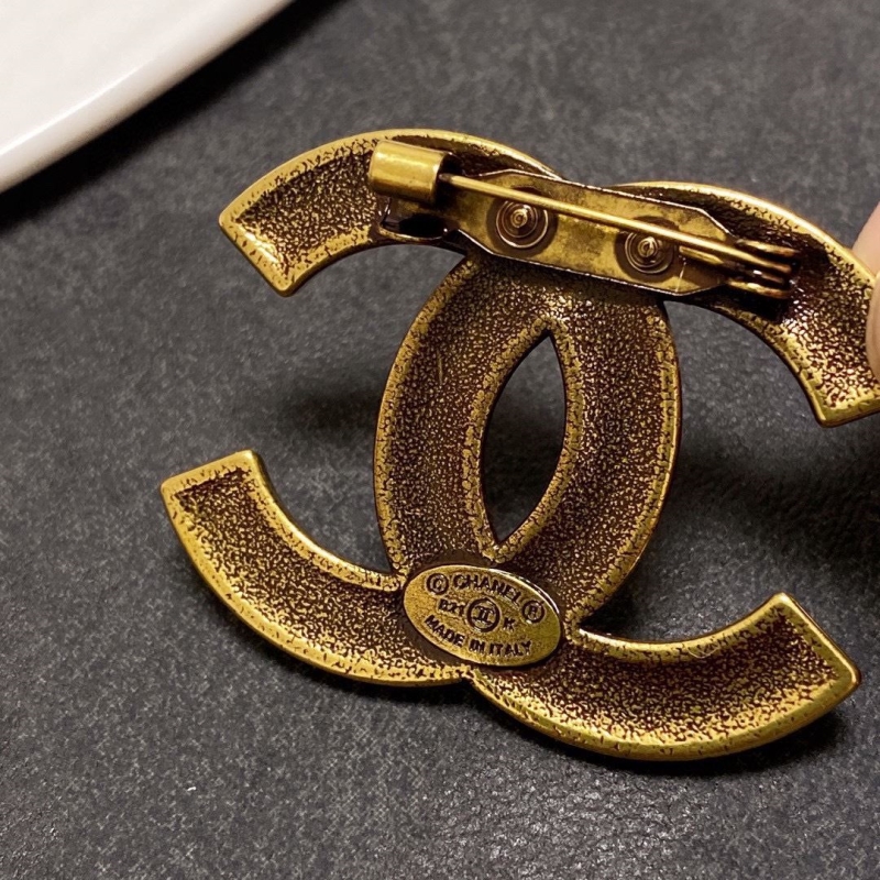Ch**el brooches